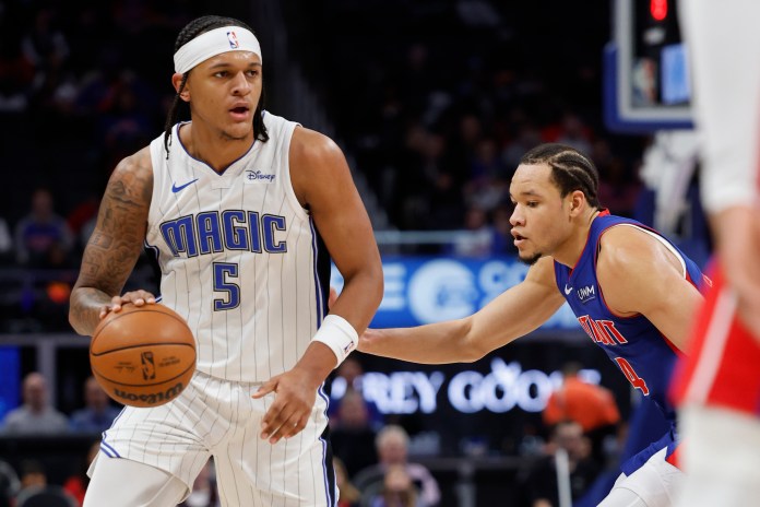 NBA: Orlando Magic at Detroit Pistons Orlando Magic forward Paolo Banchero dribbles defended by Detroit Pistons forward Kevin Knox II in the first half at Little Caesars Arena.
