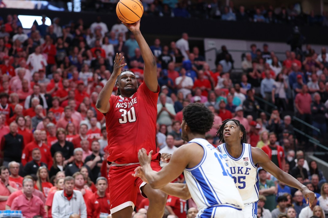 NCAA Basketball: NCAA Tournament South Regional-Duke vs NC State North Carolina State Wolfpack forward DJ Burns Jr. shoots against Duke Blue Devils forward Sean Stewart and forward Mark Mitchell