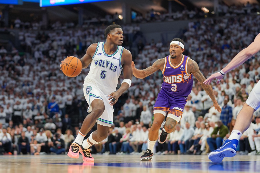 Minnesota Timberwolves guard Anthony Edwards (5) dribbles against Phoenix Suns guard Bradley Beal (3)