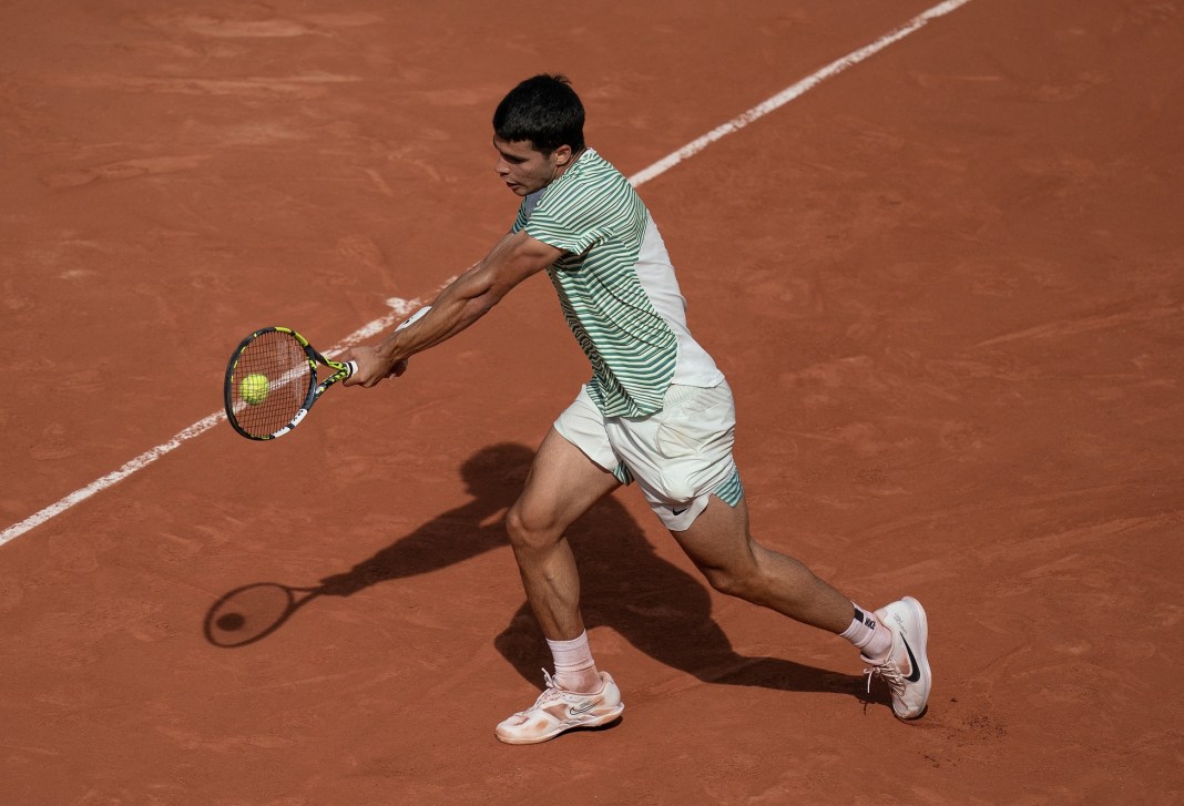 Tennis: French Open Carlos Alcaraz returns a shot during his semifinal match against Novak Djokovic on day 13 at Stade Roland-Garros.