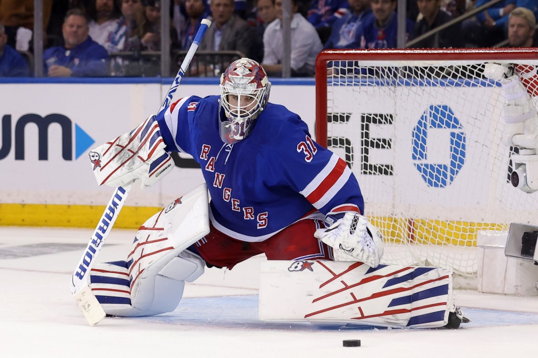 NHL: Stanley Cup Playoffs-Carolina Hurricanes at New York Rangers New York Rangers goaltender Igor Shesterkin passes the puck in the second period against the New York Islanders at Madison Square Garden.