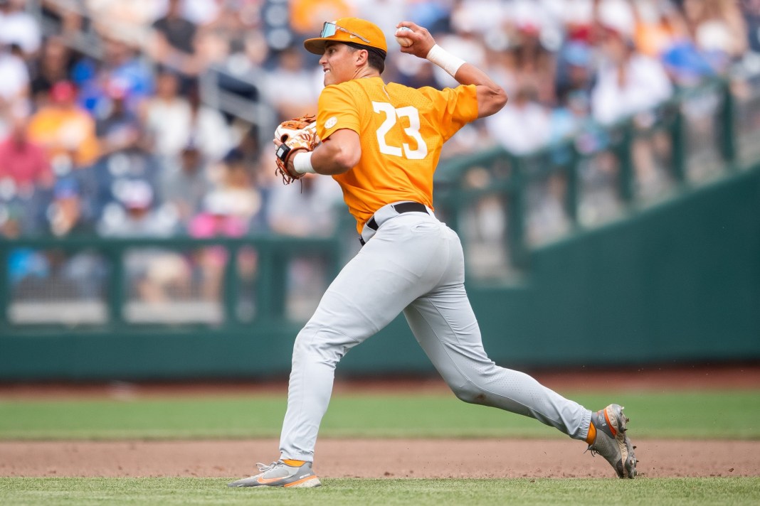 Syndication: The Knoxville News-Sentinel Tennessee's Dean Curley throws to home plate to get Florida State's Jaxson West out during a NCAA College World Series game.