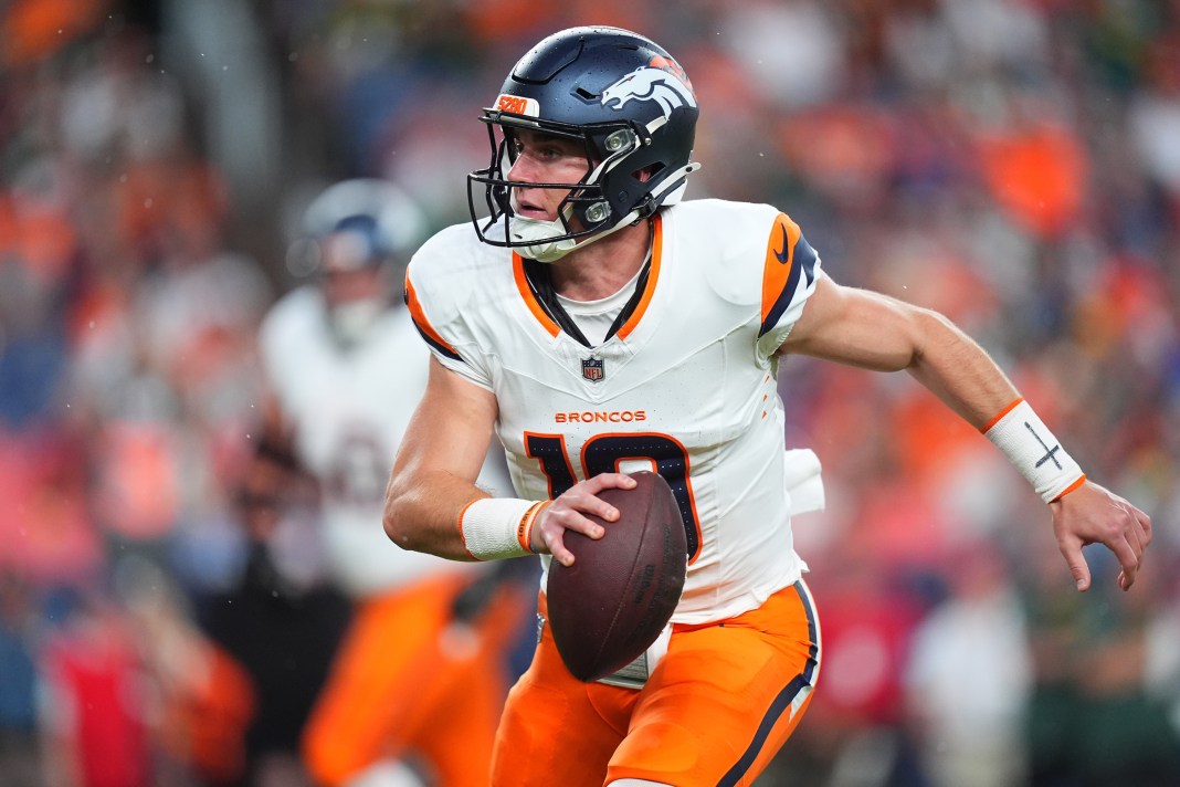 Denver Broncos quarterback Bo Nix (10) scrambles with the ball during the first quarter of the game against the Green Bay Packers at Empower Field at Mile High in Denver, Colorado, on August 18, 2024.