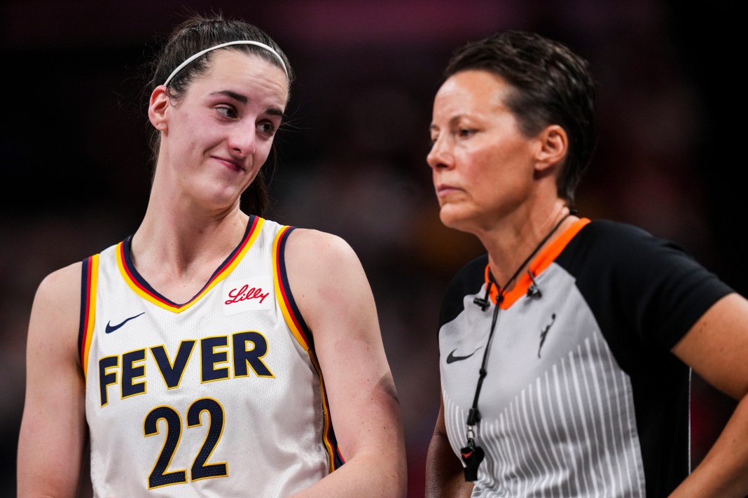 Indiana Fever guard Caitlin Clark (22) smiles at an official during the game against the Connecticut Sun at Gainbridge Fieldhouse in Indianapolis on August 28, 2024. The Fever defeated the Sun, 84-80.