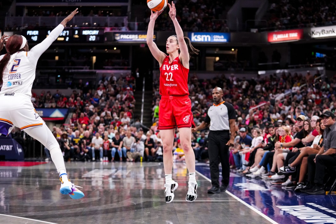 Indiana Fever guard Caitlin Clark (22) shoots a 3-pointer during the game at Gainbridge Fieldhouse in Indianapolis on Friday, August 16, 2024.