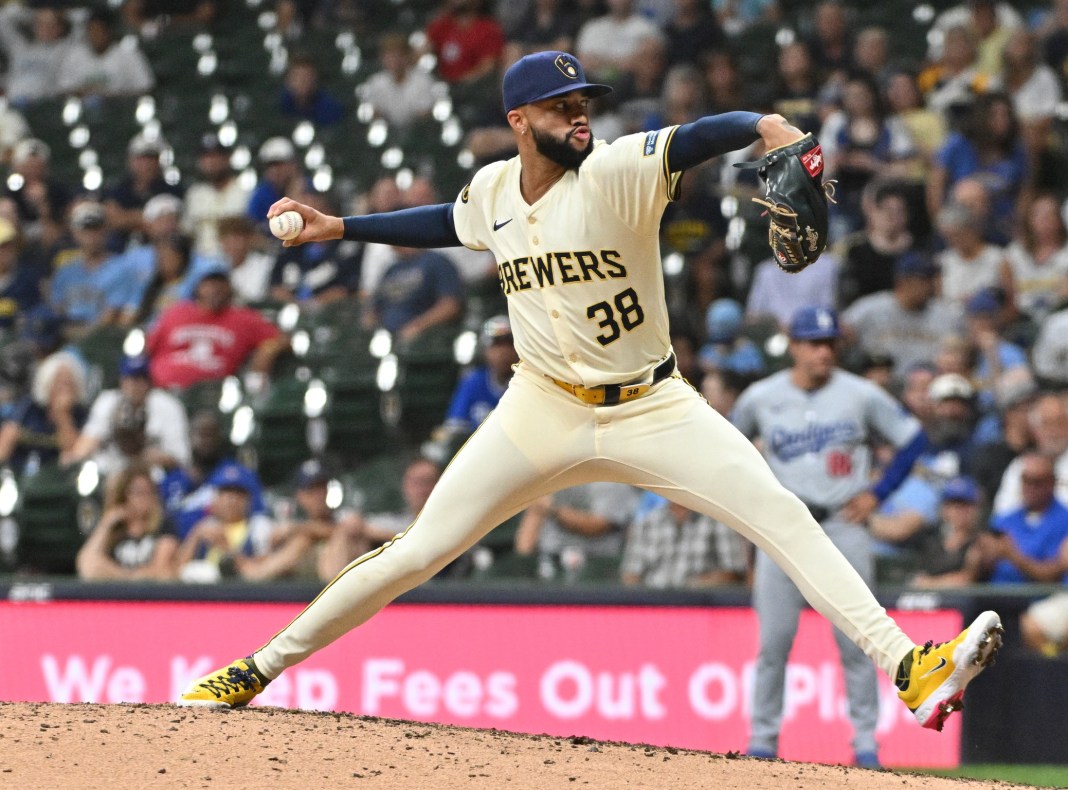Milwaukee Brewers pitcher Devin Williams (38) delivers a pitch during the ninth inning of the game against the Los Angeles Dodgers at American Family Field in Milwaukee, Wisconsin, on August 14, 2024.