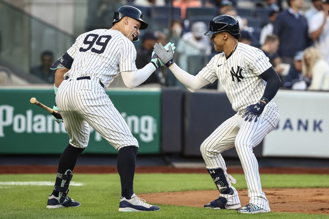New York Yankees right fielder Juan Soto (22) celebrates with center fielder Aaron Judge (99) after hitting a two-run home run in the first inning against the Cleveland Guardians at Yankee Stadium in the Bronx, New York, on August 21, 2024.