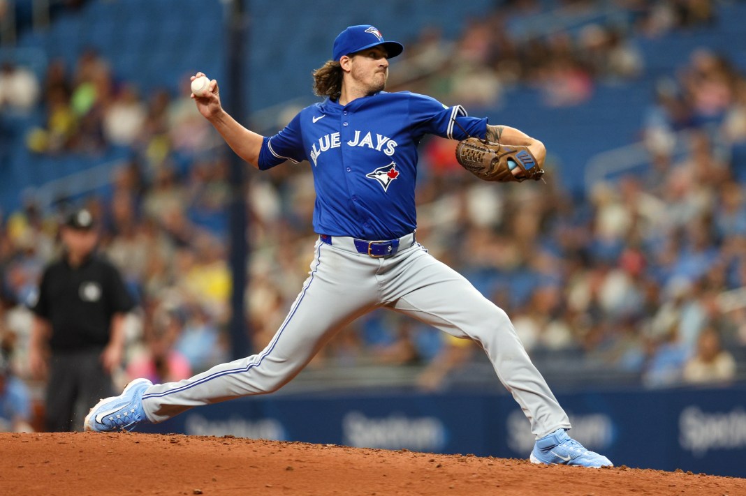 Toronto Blue Jays starting pitcher Kevin Gausman (34) delivers a pitch during the fourth inning of the game against the Tampa Bay Rays at Tropicana Field in St. Petersburg, Florida, on March 31, 2024.