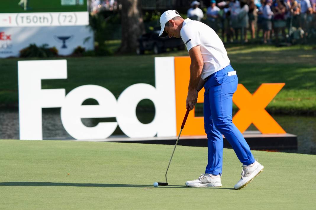 Viktor Hovland putts on the 18th hole during the final round of the FedEx St. Jude Championship at TPC Southwind in Memphis, Tennessee, on August 18, 2024, finishing tied for second place.
