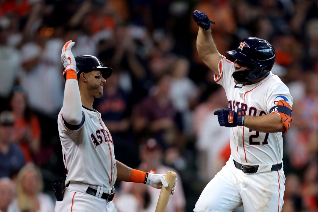 Houston Astros designated hitter Jose Altuve (27) is congratulated by shortstop Jeremy Peña (3) after hitting a home run to left field during the eighth inning of the game against the Chicago White Sox at Minute Maid Park in Houston, Texas, on August 18, 2024.
