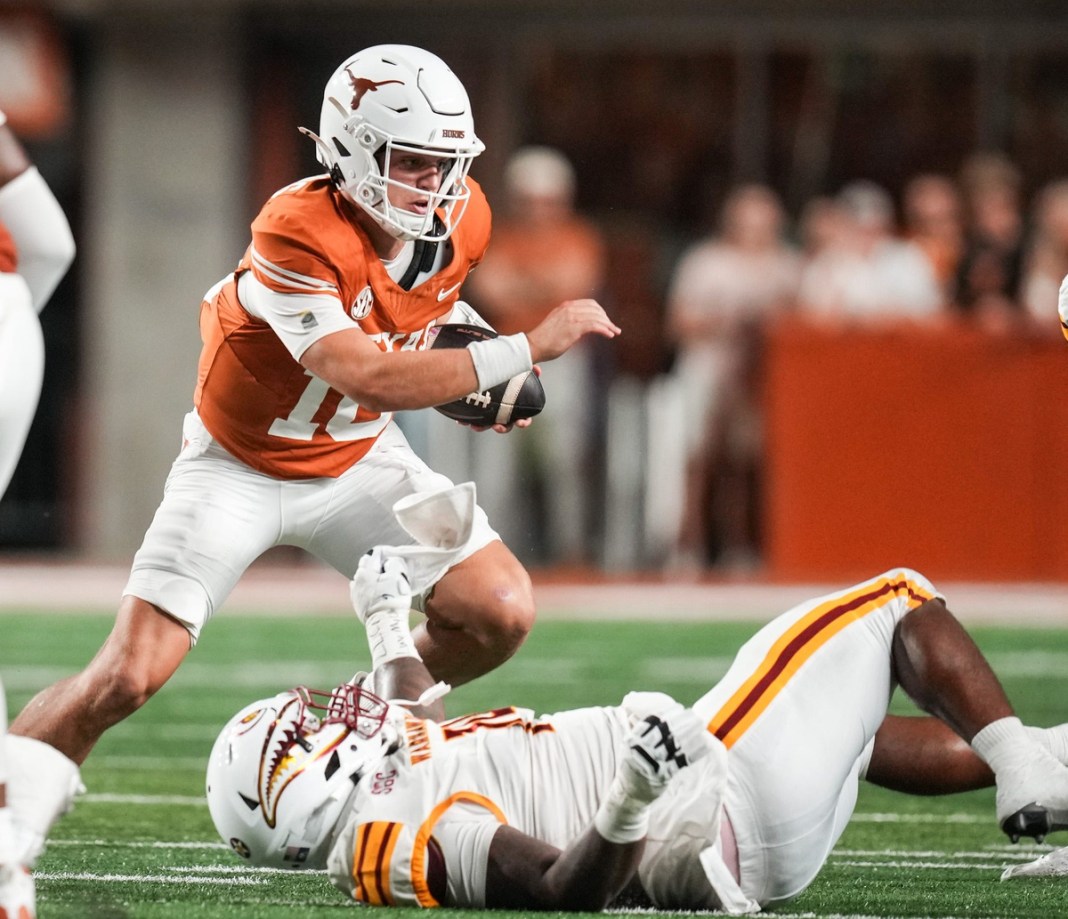 Texas Longhorns quarterback Arch Manning (16) advances the ball during the game against ULM at Darrell K Royal-Texas Memorial Stadium in Austin on September 21, 2024.