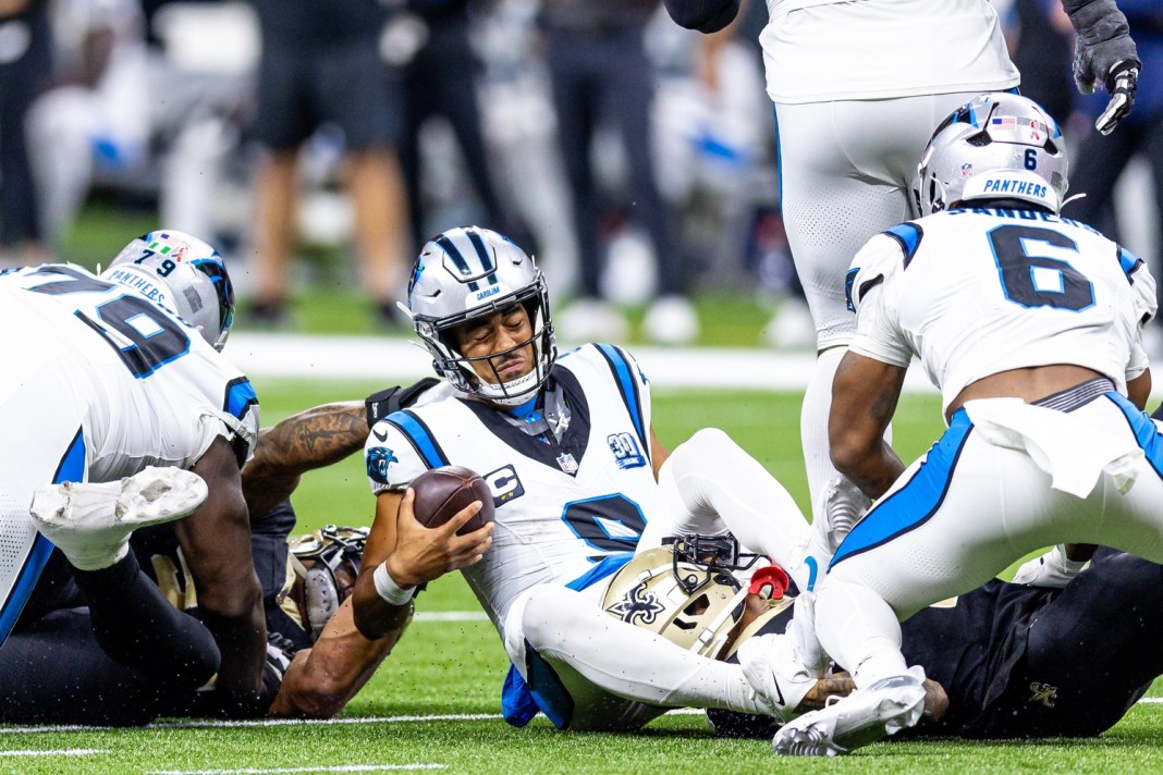 Carolina Panthers quarterback Bryce Young (9) is tackled as he scrambles out of the pocket by New Orleans Saints cornerback Alontae Taylor (1) during the second half at Caesars Superdome on September 8, 2024.