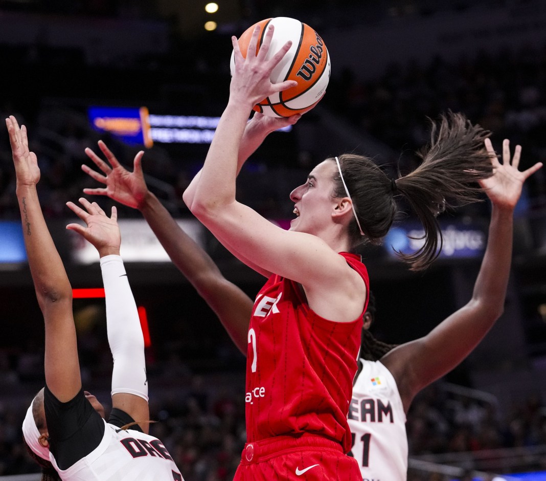 Indiana Fever guard Caitlin Clark (22) goes up for a shot during a game between the Indiana Fever and the Atlanta Dream at Gainbridge Fieldhouse on September 8, 2024.