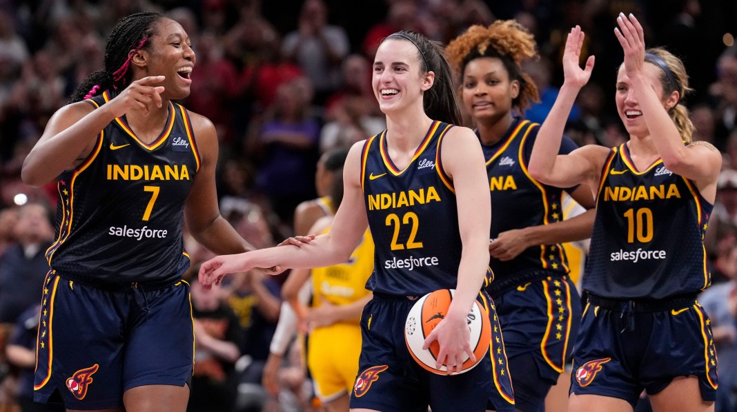 Indiana Fever forward Aliyah Boston (7) celebrates with guard Caitlin Clark (22) after recording a triple-double on Wednesday, September 4, 2024, during the game at Gainbridge Fieldhouse in Indianapolis. The Indiana Fever defeated the Los Angeles Sparks, 93-86.