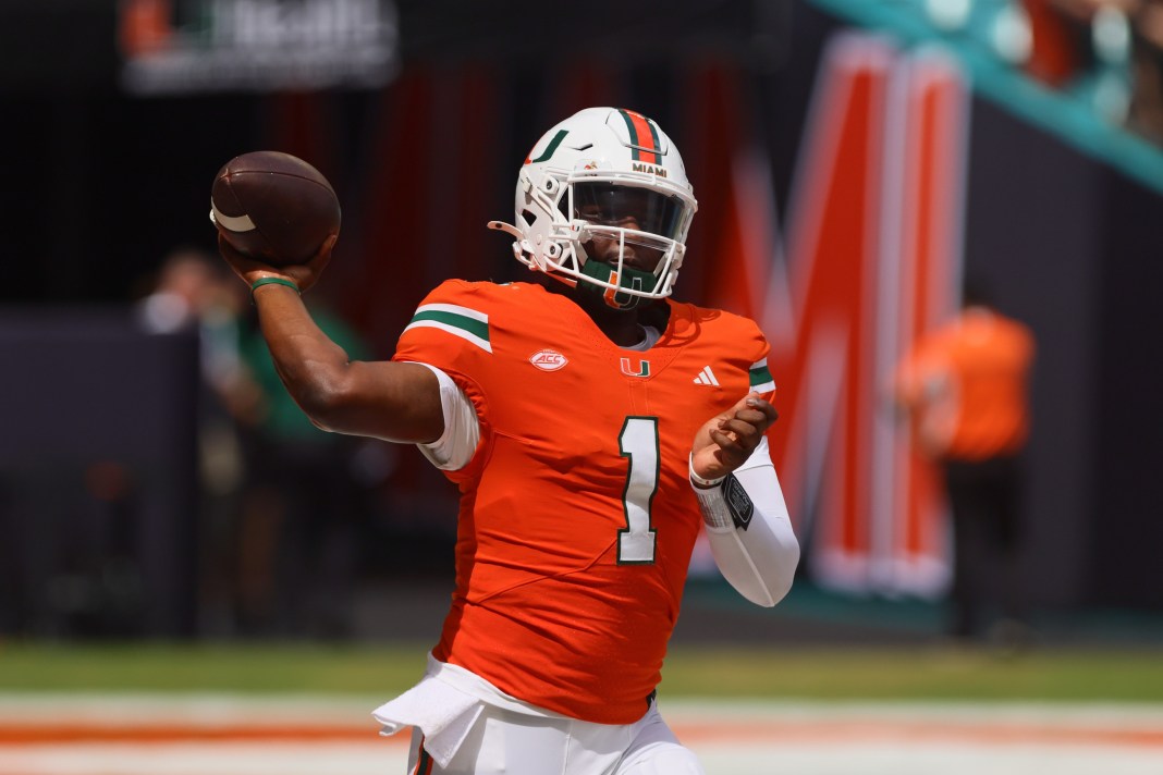 Miami Hurricanes quarterback Cam Ward (1) throws the football before the game against the Ball State Cardinals at Hard Rock Stadium on September 14, 2024.