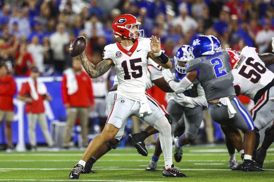 Georgia Bulldogs quarterback Carson Beck (15) drops back to pass during the first quarter against the Kentucky Wildcats at Kroger Field on September 14, 2024.