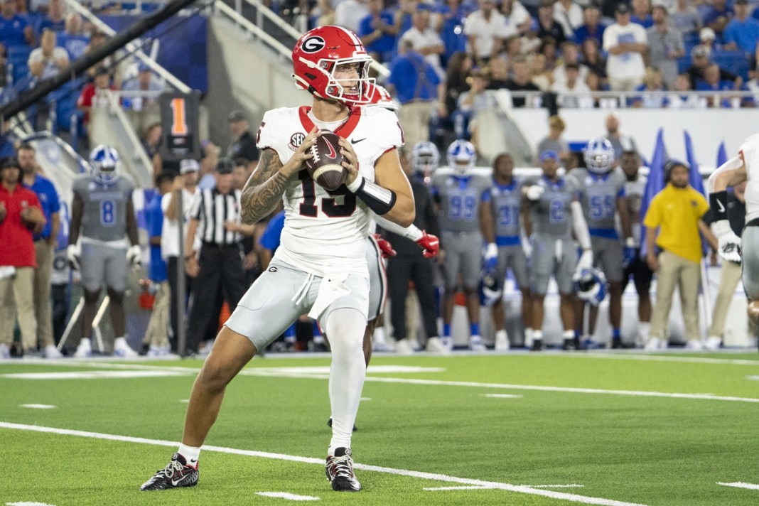 Georgia Bulldogs quarterback Carson Beck (15) looks for an open teammate during the second quarter against the Kentucky Wildcats at Kroger Field on September 14, 2024.