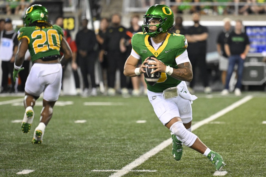Oregon Ducks quarterback Dillon Gabriel (8) looks downfield to pass the ball during the second half against the Boise State Broncos at Autzen Stadium on September 7, 2024.