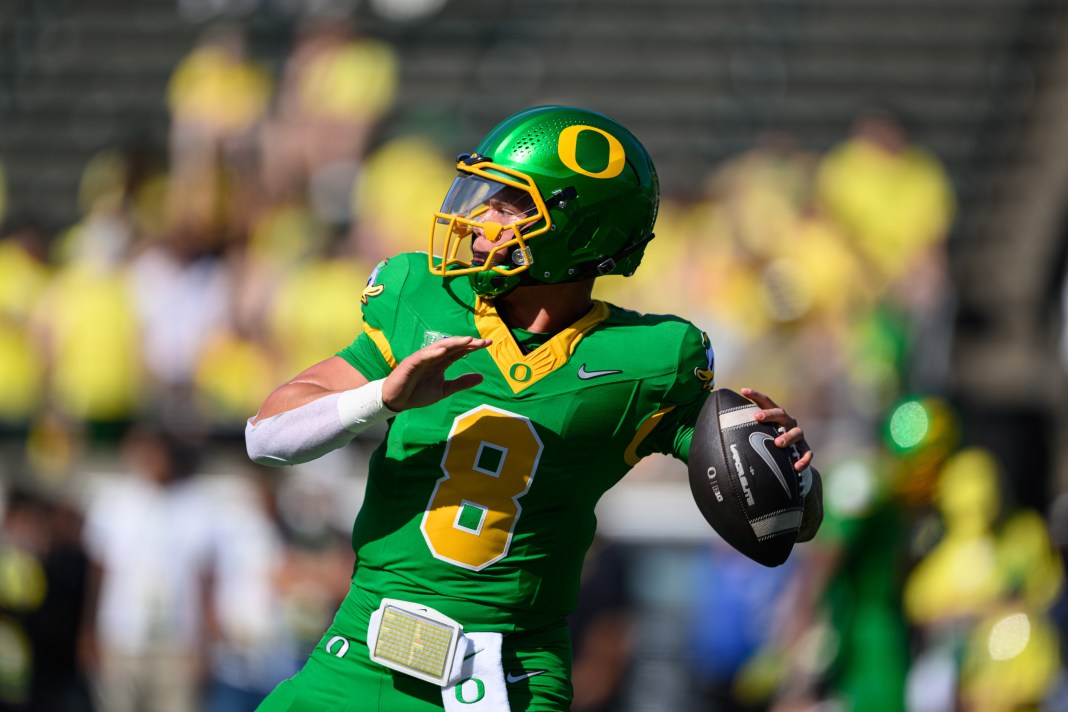Oregon Ducks quarterback Dillon Gabriel (8) throws a pass while warming up before the game against the Idaho Vandals at Autzen Stadium on August 31, 2024.