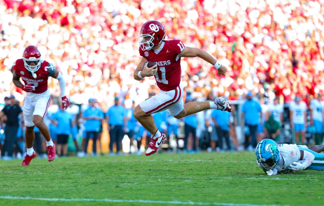 Oklahoma Sooners quarterback Jackson Arnold (11) runs for a touchdown during the second half against the Tulane Green Wave at Gaylord Family-Oklahoma Memorial Stadium on September 14, 2024.