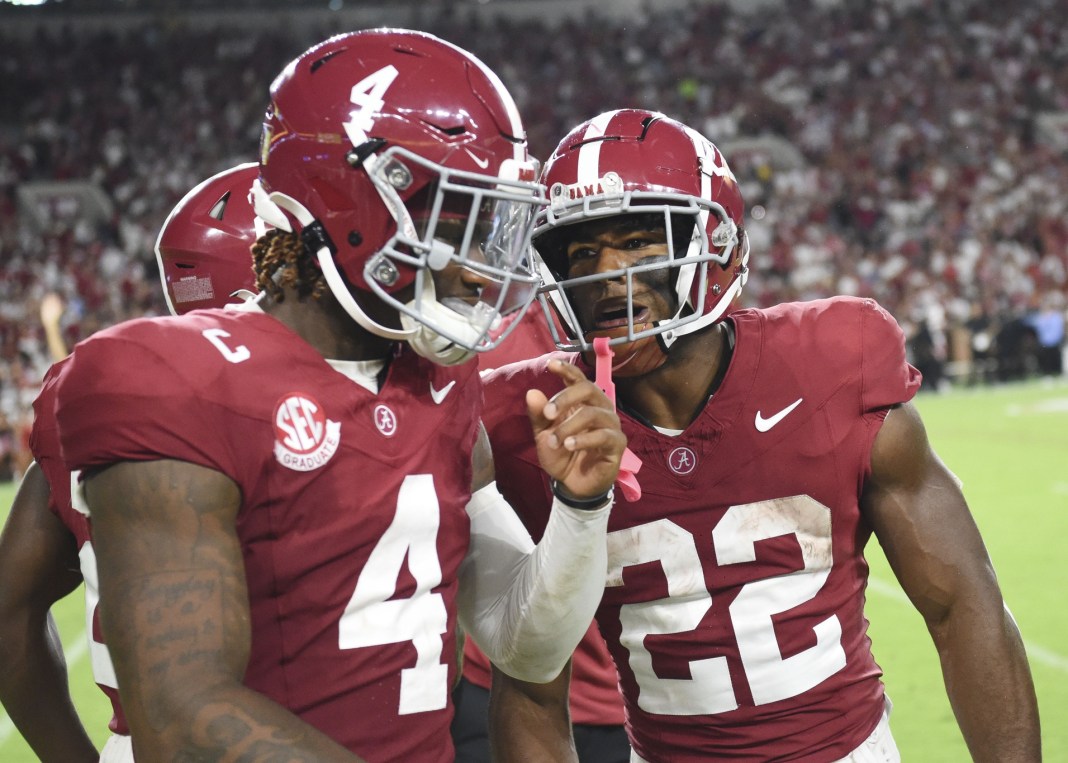 Alabama Crimson Tide quarterback Jalen Milroe (4) and running back Justice Haynes (22) walk to the sideline after Haynes scores on an 85-yard touchdown run against Western Kentucky at Bryant-Denny Stadium on August 31, 2024.