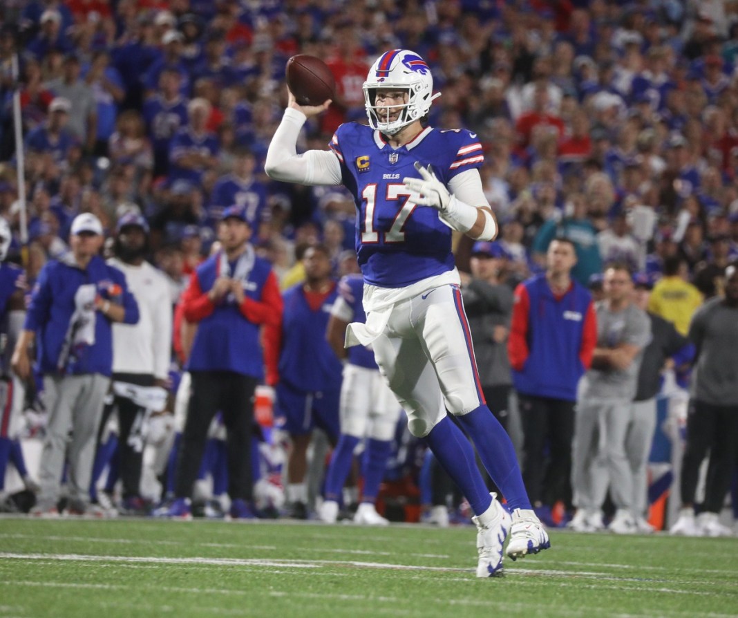 Bills quarterback Josh Allen pretends to throw a pass before running for several yards during the second half at Highmark Stadium in Orchard Park on September 23, 2024.