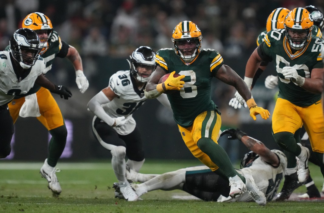 Green Bay Packers running back Josh Jacobs (8) runs during the second half against the Philadelphia Eagles at Neo Quimica Arena in Sao Paulo, Brazil, on September 6, 2024.
