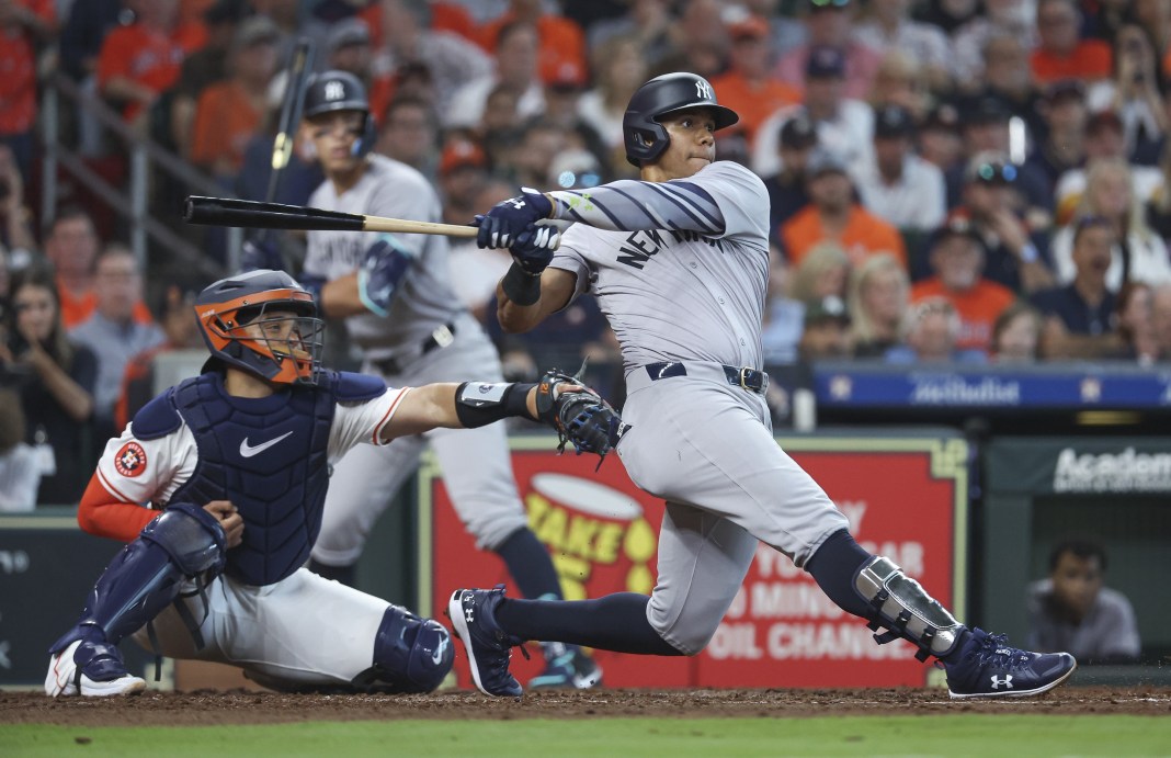 New York Yankees right fielder Juan Soto (22) hits an RBI single during the fifth inning against the Houston Astros at Minute Maid Park on March 28, 2024.