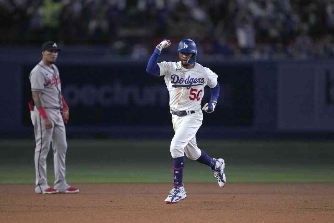 Los Angeles Dodgers second baseman Mookie Betts (50) runs the bases after hitting a three-run home run in the fifth inning against the Atlanta Braves at Dodger Stadium on August 31, 2023.