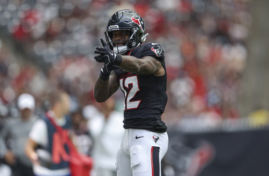 Houston Texans wide receiver Nico Collins (12) signals after a first down during the game against the New York Giants at NRG Stadium on August 17, 2024