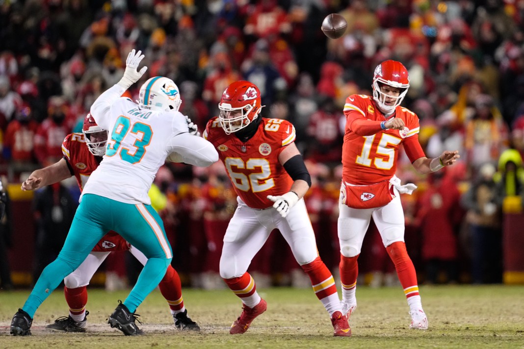NFL: AFC Wild Card Round-Miami Dolphins at Kansas City Chiefs Kansas City Chiefs quarterback Patrick Mahomes throws as guard Joe Thuney covers against Miami Dolphins defensive tackle Da'Shawn Hand.