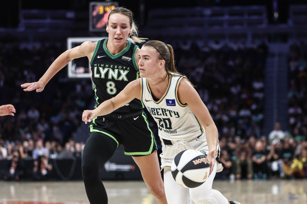 Jun 25, 2024; Belmont Park, New York, USA; New York Liberty guard Sabrina Ionescu (20) dribbles past Minnesota Lynx forward Alanna Smith (8) in the fourth quarter of the Commissioner’s Cup Championship game at UBS Arena. Mandatory Credit: Wendell Cruz-USA TODAY Sports