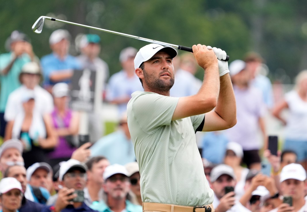 Scottie Scheffler plays his shot off the 9th tee during the final round of the TOUR Championship golf tournament in Atlanta, Georgia, on September 1, 2024.