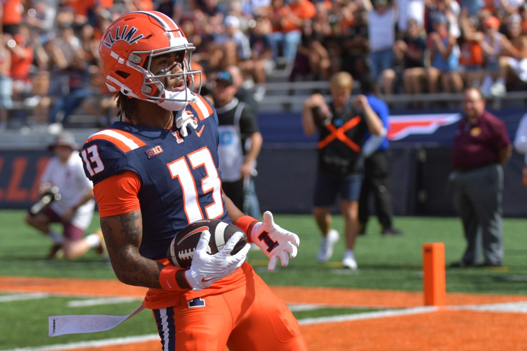 NCAA Football: Central Michigan at Illinois Illinois Fighting Illini wide receiver Pat Bryant (13) scores a touchdown against the Central Michigan Chippewas during the first half at Memorial Stadium on September 14, 2024.