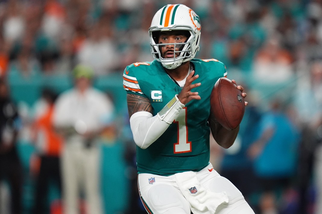 Miami Dolphins quarterback Tua Tagovailoa (1) drops back with the ball against the Buffalo Bills during the first half at Hard Rock Stadium on September 12, 2024.