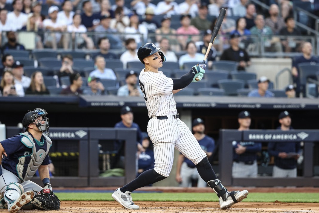 New York Yankees center fielder Aaron Judge (99) hits a two-run home run during the first inning against the Seattle Mariners at Yankee Stadium on May 22, 2024.