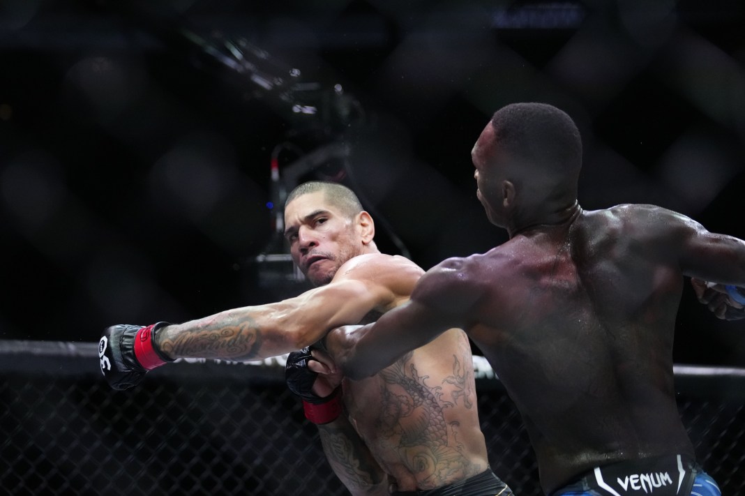 Alex Pereira (red gloves) fights Israel Adesanya (blue gloves) during UFC 287 at Miami-Dade Arena in Miami, Florida, on April 8, 2023.