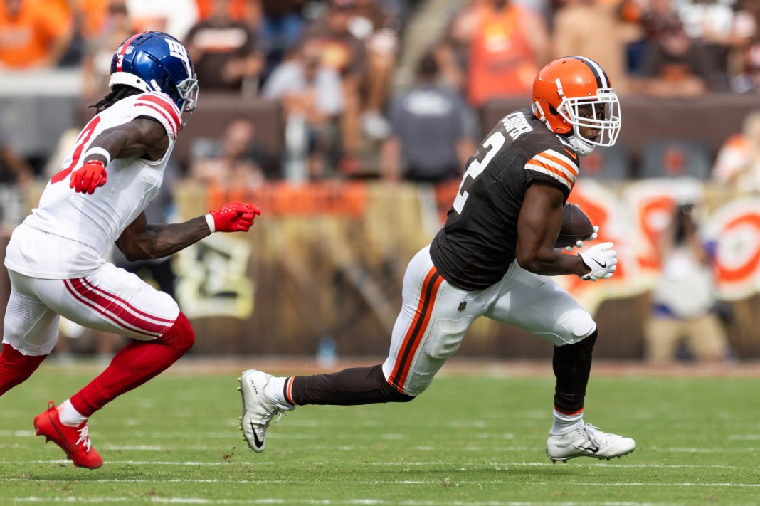 Cleveland Browns wide receiver Amari Cooper (2) runs with the ball, evading New York Giants cornerback Deonte Banks (3) during the fourth quarter at Huntington Bank Field on September 22, 2024.