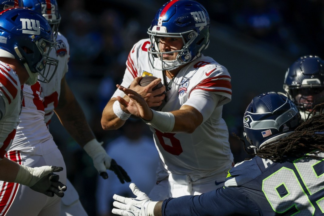 New York Giants quarterback Daniel Jones (8) rushes against the Seattle Seahawks during the second quarter at Lumen Field