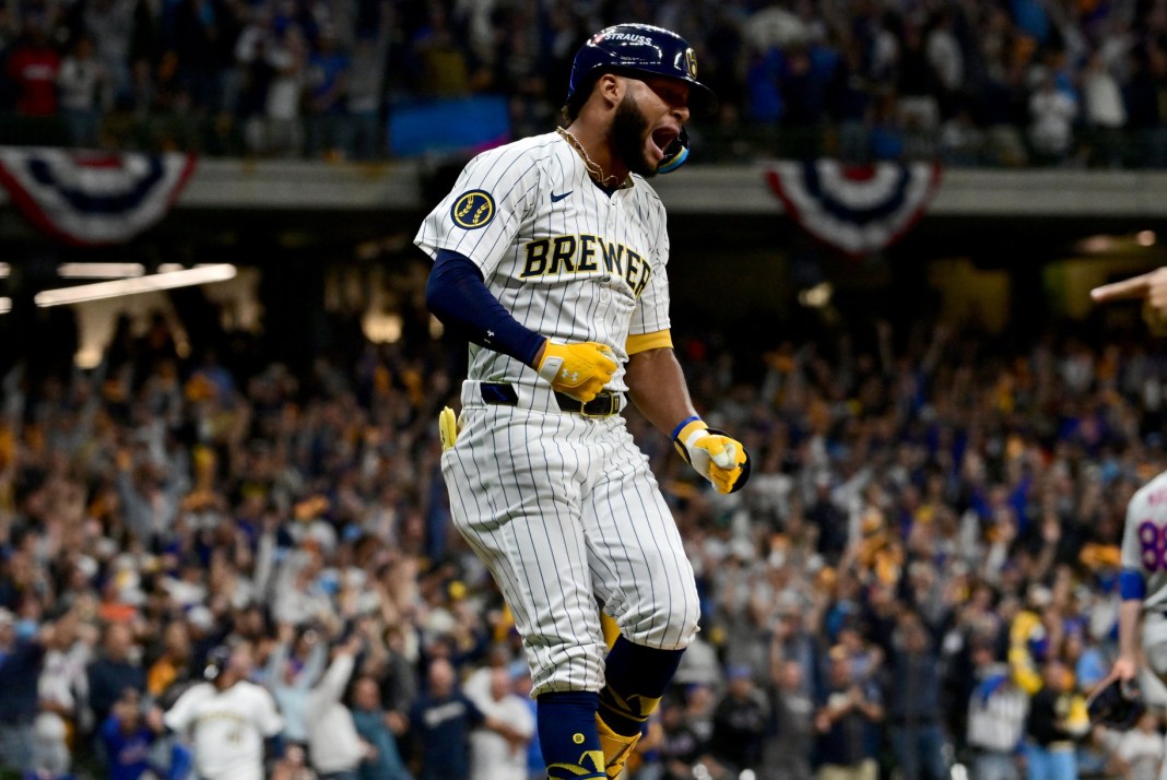 Milwaukee Brewers outfielder Jackson Chourio (11) celebrates after hitting a home run during the eighth inning of Game 2 of the Wildcard round against the New York Mets at American Family Field on October 2, 2024