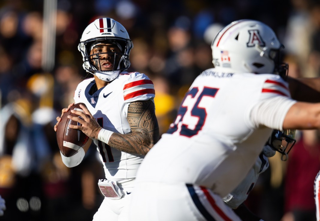 Arizona Wildcats quarterback Noah Fifita (11) in action during the first half against the Arizona State Sun Devils in the Territorial Cup at Mountain America Stadium on November 25, 2023.
