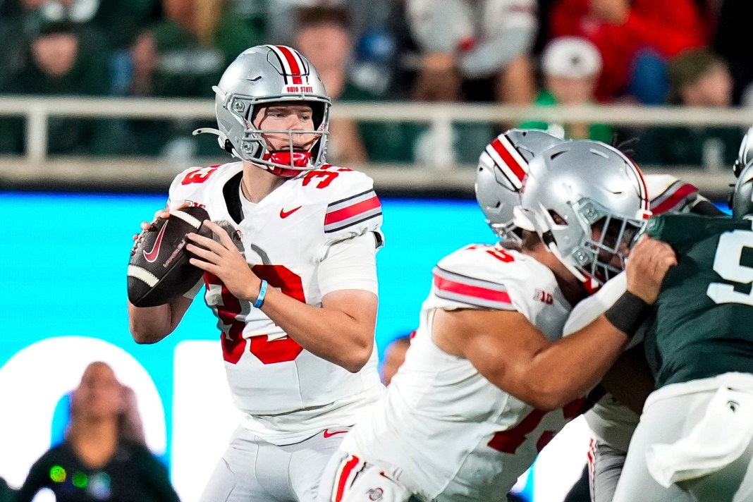 Syndication: The Columbus Dispatch Ohio State Buckeyes quarterback Devin Brown looks to pass the ball in the second half at Spartan Stadium on Saturday.