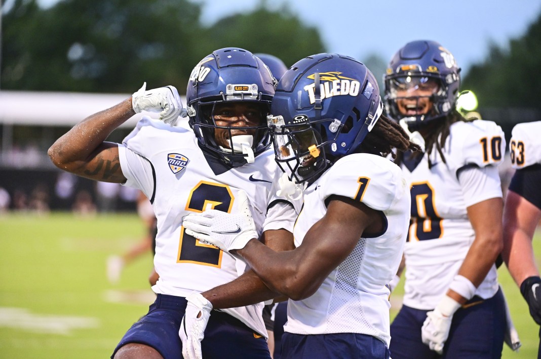 NCAA Football: Toledo at Mississippi State Toledo Rockets wide receiver Junior Vandeross III (2) reacts with Toledo Rockets wide receiver Jerjuan Newton (1) after a touchdown against Mississippi State Bulldogs