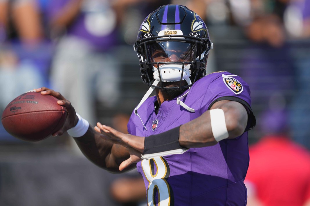 Ravens quarterback Lamar Jackson warms up before taking on the Commanders in Week 6 of the 2024 NFL season. AFC North