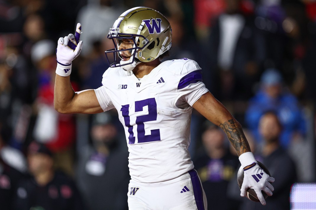 Washington Huskies wide receiver Denzel Boston (12) celebrates his touchdown during the second half against the Rutgers Scarlet Knights at SHI Stadium on September 27, 2024.
