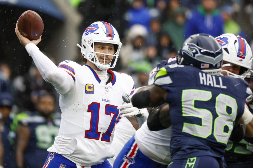 Buffalo Bills quarterback Josh Allen (17) passes against the Seattle Seahawks during the second quarter at Lumen Field.