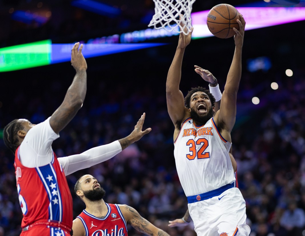 NBA: New York Knicks at Philadelphia 76ers New York Knicks center Karl-Anthony Towns drives for a shot next to Philadelphia 76ers center Andre Drummond