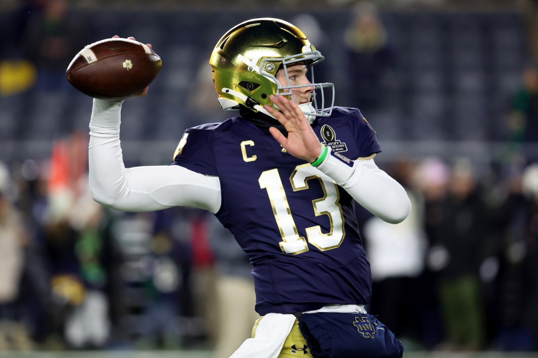 NCAA Football: CFP National Playoff First Round-Indiana at Notre Dame Notre Dame quarterback Riley Leonard (13) warms up before the first-round playoff game against the Indiana Hoosiers at Notre Dame Stadium on December 20, 2024.