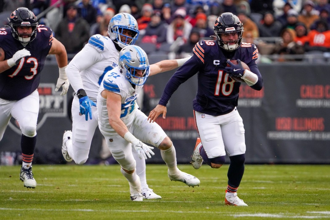 Syndication: Detroit Free Press Chicago Bears quarterback Caleb Williams (18) runs with the ball during the game against the Detroit Lions at Soldier Field on December 22, 2024. The Lions won 34-17