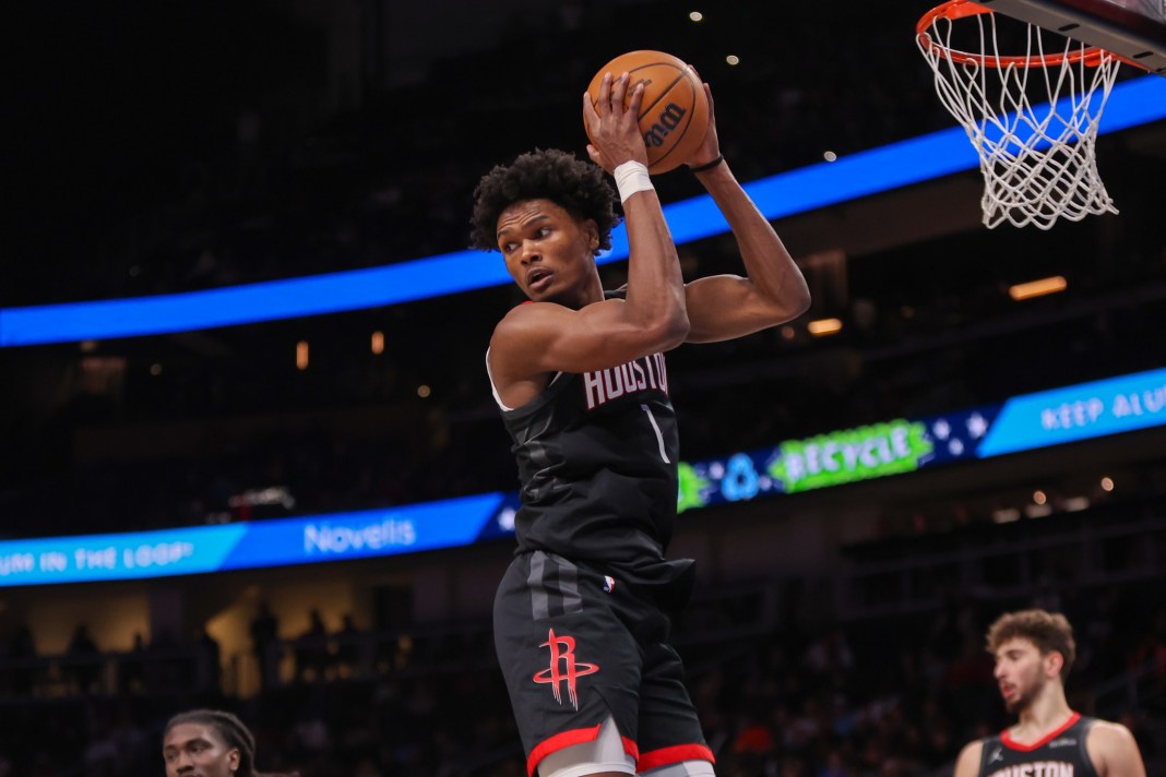Houston Rockets forward Amen Thompson (1) grabs a rebound during the first quarter against the Atlanta Hawks at State Farm Arena on January 28, 2025
